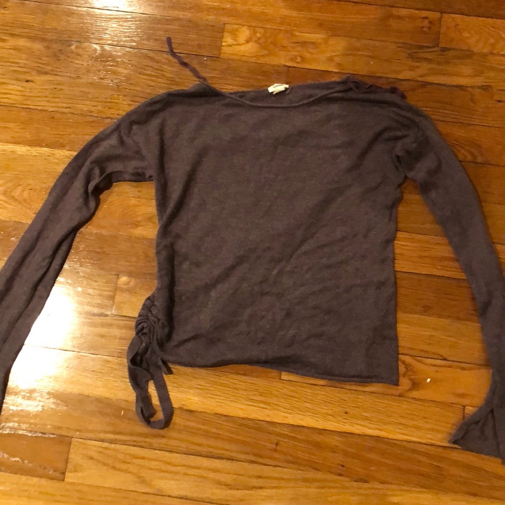 A purple long sleeves with a thing on the side